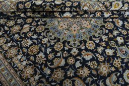 Close-up detail of 2000s Kashan rug from Iran / Persia showing Wool weave