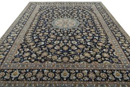 Surface texture of 2000s Kashan rug with natural Wool and intricate pattern