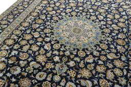 Backside of handmade 2000s Kashan rug showing knot structure and weave density
