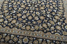 Close-up detail of 2000s Kashan rug from Iran / Persia showing Wool weave