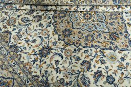 Close-up detail of 2000s Kashan rug from Iran / Persia showing Wool weave