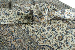Surface texture of 2000s Kashan rug with natural Wool and intricate pattern
