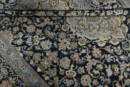 Close-up detail of 2000s Kashan rug from Iran / Persia showing Wool weave