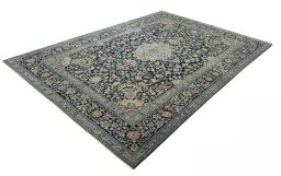 Corner detail of 2000s Kashan rug showing border pattern and Wool pile