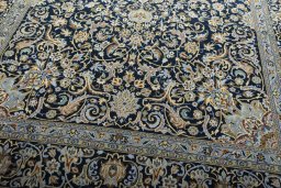 Close-up detail of 2000s Kashan rug from Iran / Persia showing Wool weave