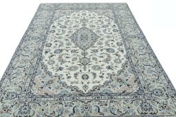 Surface texture of 2000s Kashan rug with natural Wool and intricate pattern