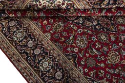Close-up detail of 2000s Kashan rug from Iran / Persia showing Wool weave