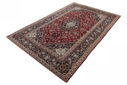 Corner detail of 2000s Kashan rug showing border pattern and Wool pile