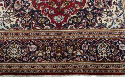Full view of 2000s Kashan rug from Iran / Persia, 308 × 198 cm in Red tones