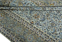 Close-up detail of 2000s Kashan rug from Iran / Persia showing Wool weave
