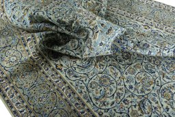 Surface texture of 2000s Kashan rug with natural Wool and intricate pattern
