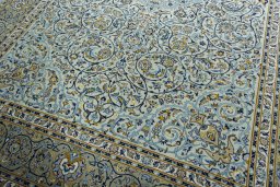 Close-up detail of 2000s Kashan rug from Iran / Persia showing Wool weave