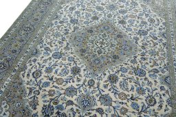 Backside of handmade 2000s Kashan rug showing knot structure and weave density