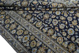 Close-up detail of 2000s Kashan rug from Iran / Persia showing Wool weave
