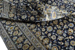Surface texture of 2000s Kashan rug with natural Wool and intricate pattern