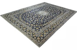 Corner detail of 2000s Kashan rug showing border pattern and Wool pile