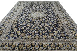 Surface texture of 2000s Kashan rug with natural Wool and intricate pattern