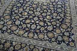 Close-up detail of 2000s Kashan rug from Iran / Persia showing Wool weave