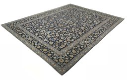 Corner detail of 2000s Kashan rug showing border pattern and Wool pile
