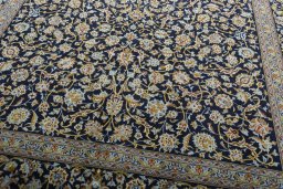 Close-up detail of 2000s Kashan rug from Iran / Persia showing Wool weave