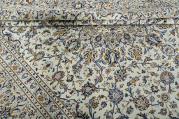 Close-up detail of 2000s Kashan rug from Iran / Persia showing Wool weave