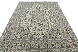 Surface texture of 2000s Kashan rug with natural Wool and intricate pattern