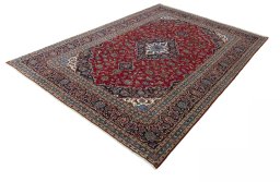 Corner detail of 2000s Kashan rug showing border pattern and Wool pile