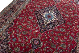 Backside of handmade 2000s Kashan rug showing knot structure and weave density