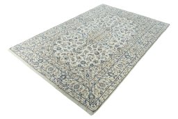 Corner detail of 2000s Kashan rug showing border pattern and Wool pile