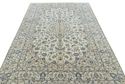 Surface texture of 2000s Kashan rug with natural Wool and intricate pattern