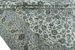 Close-up detail of 2000s Kashan rug from Iran / Persia showing Wool weave