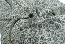 Surface texture of 2000s Kashan rug with natural Wool and intricate pattern