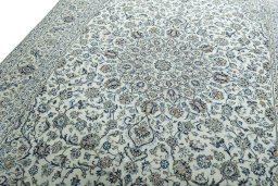 Backside of handmade 2000s Kashan rug showing knot structure and weave density