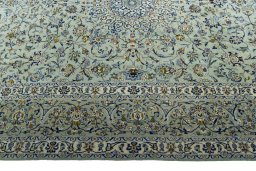 Corner detail of 2000s Kashan rug showing border pattern and Wool pile