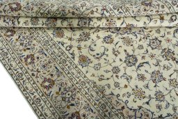 Close-up detail of 2000s Kashan rug from Iran / Persia showing Wool weave