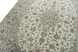 Backside of handmade 2000s Kashan rug showing knot structure and weave density
