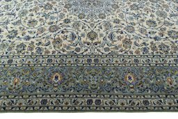 Corner detail of 2000s Kashan rug showing border pattern and Wool pile