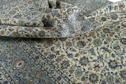Surface texture of 2000s Kashan rug with natural Wool and intricate pattern