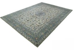 Corner detail of 2000s Kashan rug showing border pattern and Wool pile