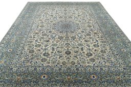 Surface texture of 2000s Kashan rug with natural Wool and intricate pattern
