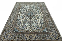 Surface texture of 2000s Kashan rug with natural Wool and intricate pattern