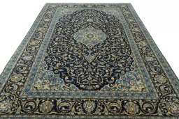 Surface texture of 2000s Kashan rug with natural Wool and intricate pattern