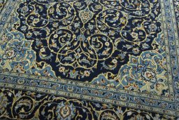 Close-up detail of 2000s Kashan rug from Iran / Persia showing Wool weave