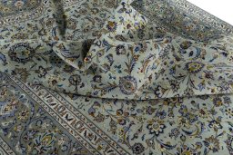 Surface texture of 2000s Kashan rug with natural Wool and intricate pattern
