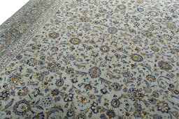 Backside of handmade 2000s Kashan rug showing knot structure and weave density