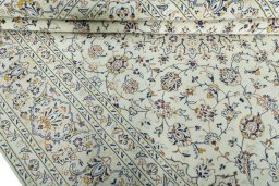 Close-up detail of 2000s Kashan rug from Iran / Persia showing Wool weave
