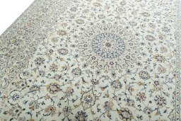 Backside of handmade 2000s Kashan rug showing knot structure and weave density