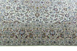 Corner detail of 2000s Kashan rug showing border pattern and Wool pile