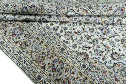 Close-up detail of 2000s Kashan rug from Iran / Persia showing Wool weave