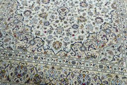 Close-up detail of 2000s Kashan rug from Iran / Persia showing Wool weave